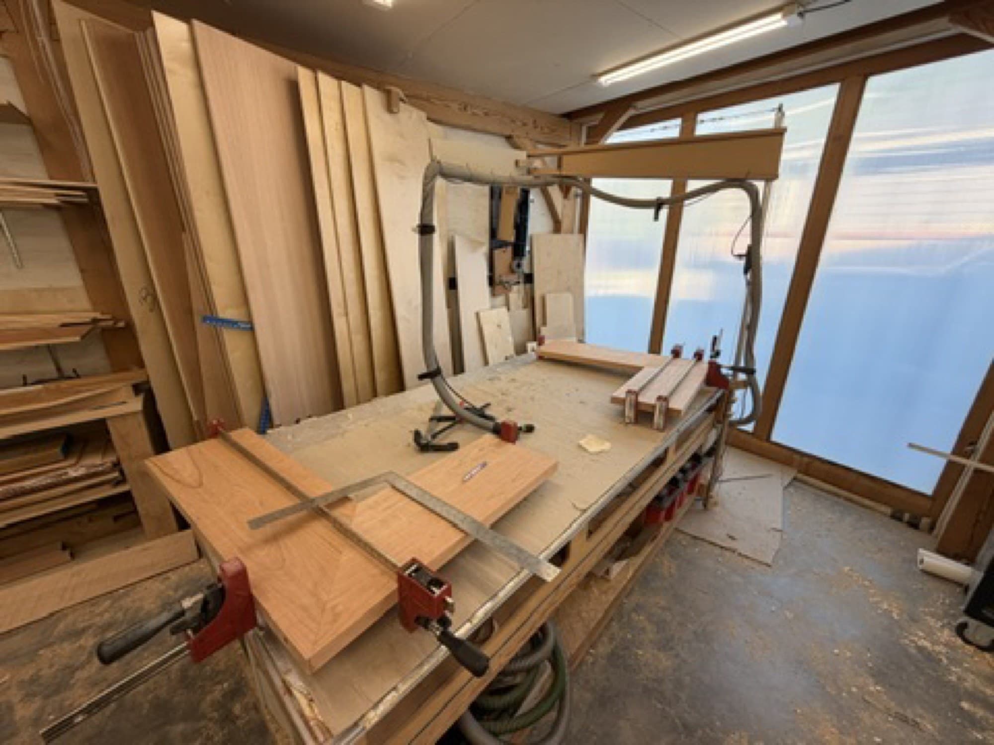 Cherry shelf boxes clamped during assembly in the Heartwood Cabinets shop