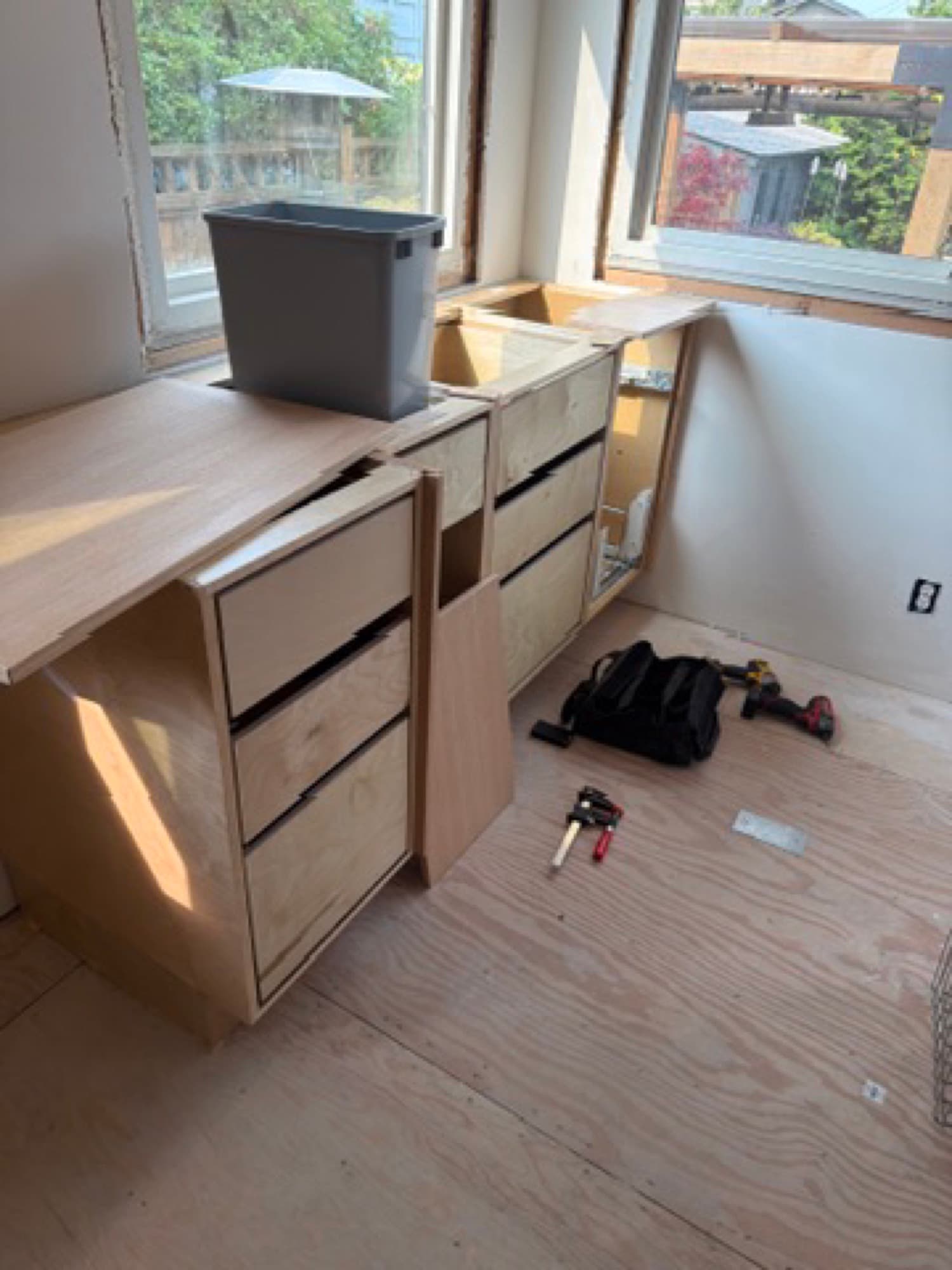 Close view of a custom drawer bank near the end of installation
